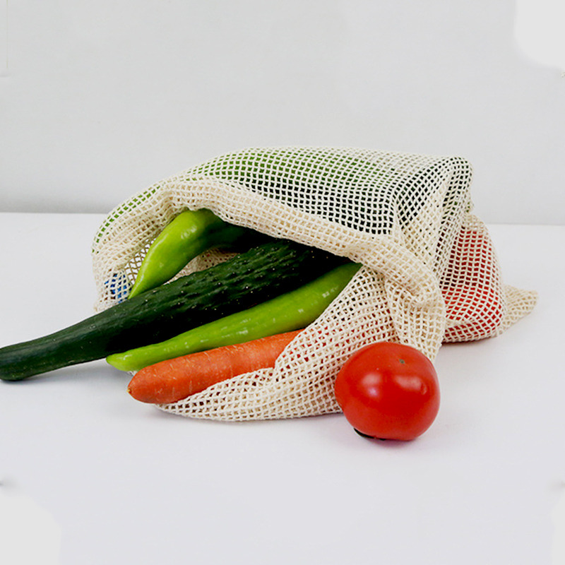 Venta al por mayor portátil 100% algodón Almacenamiento ecológico Verduras y frutas Bolsa de malla con cordón para ir de compras